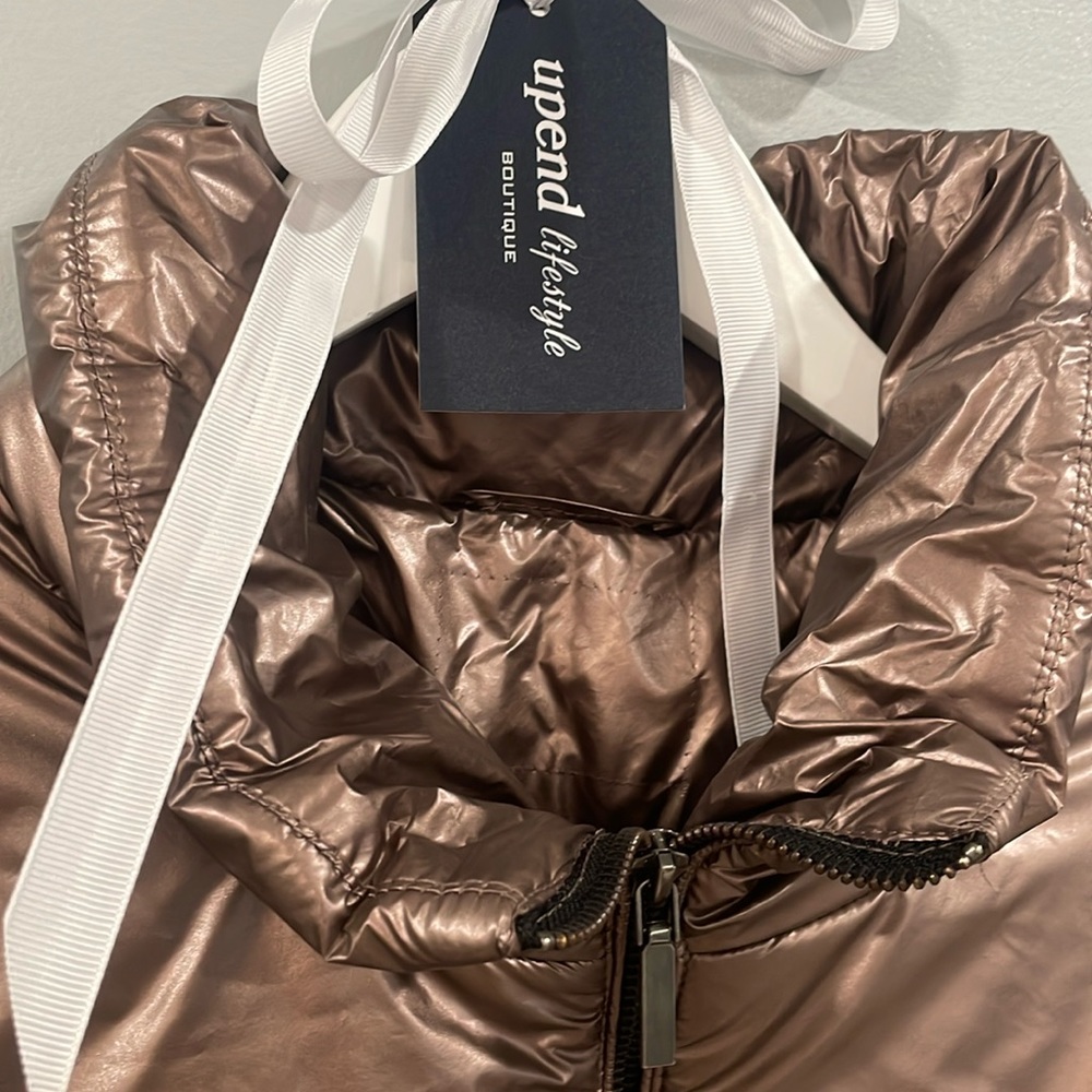 Metallic Rose Bronze puffer jacket.